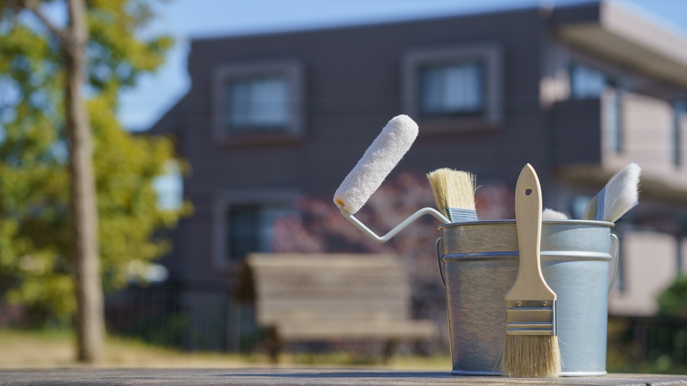 Painting,tools,and,residential,area.image,of,roof,and,exterior,painting.