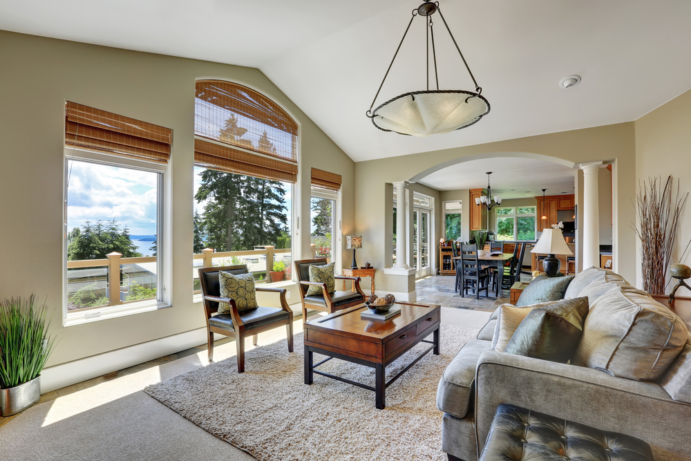 Vaulted,ceiling,living,room,with,large,windows,overlooking,beautiful,view,