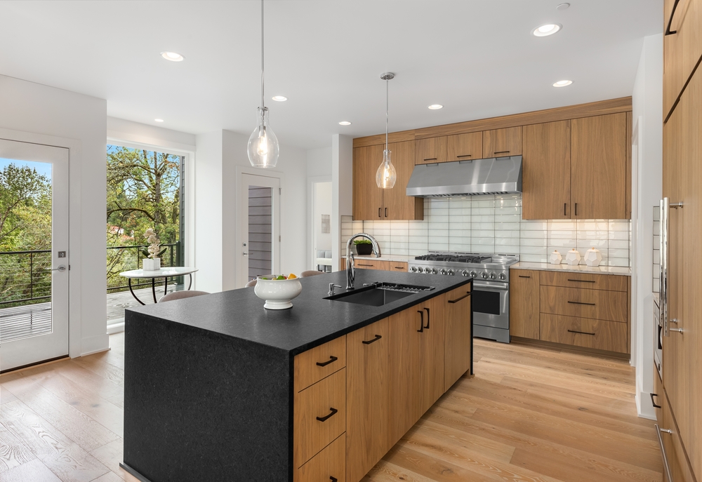 Beautiful,kitchen,in,new,luxury,home,with,quartz,waterfall,island,